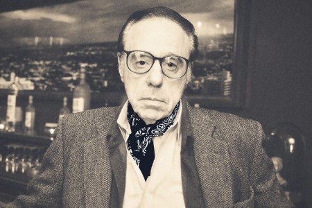 Peter Bogdanovich wearing a sportcoat and his ever-present bandana