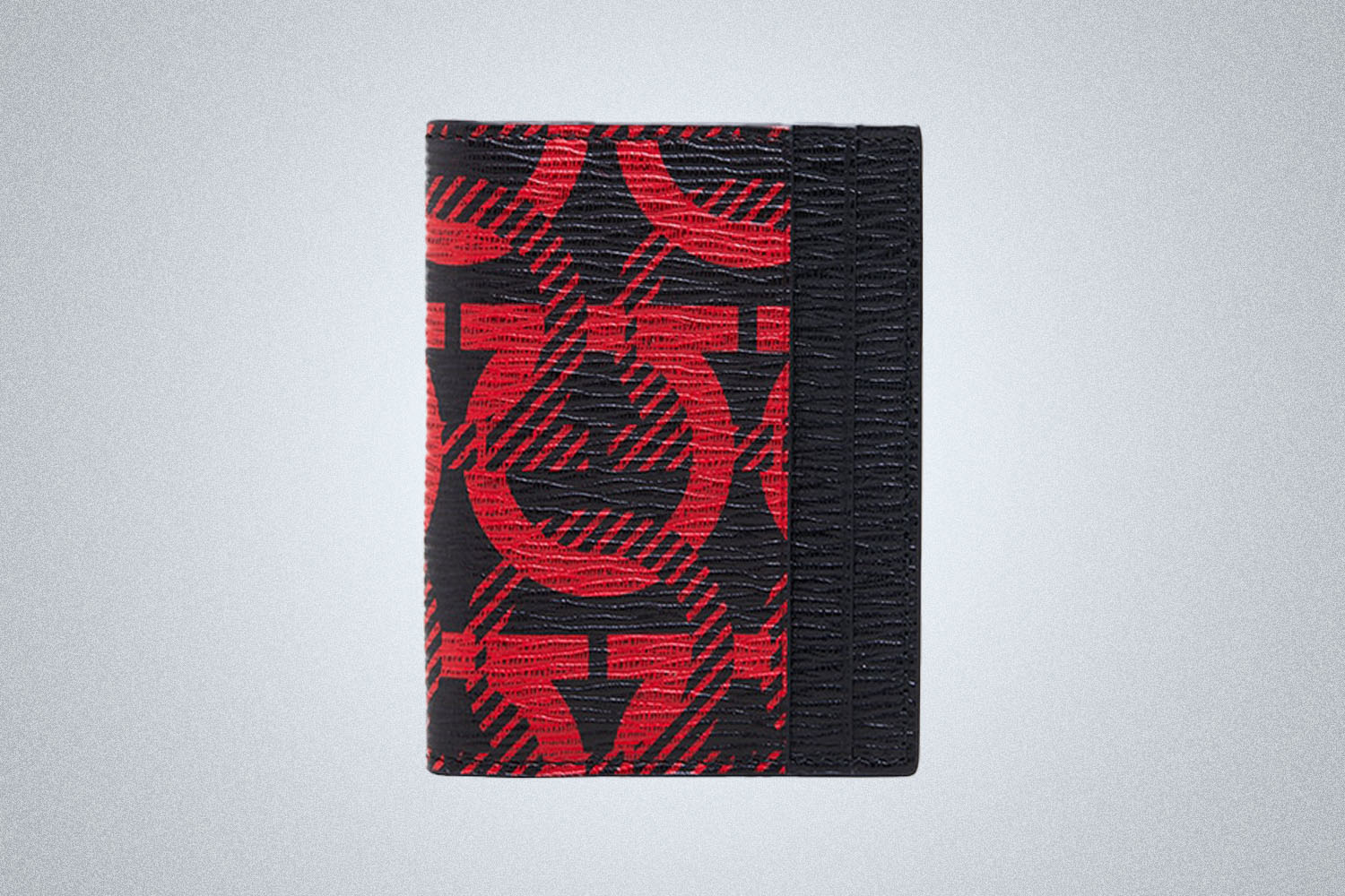a red and black patterned credit card holder.