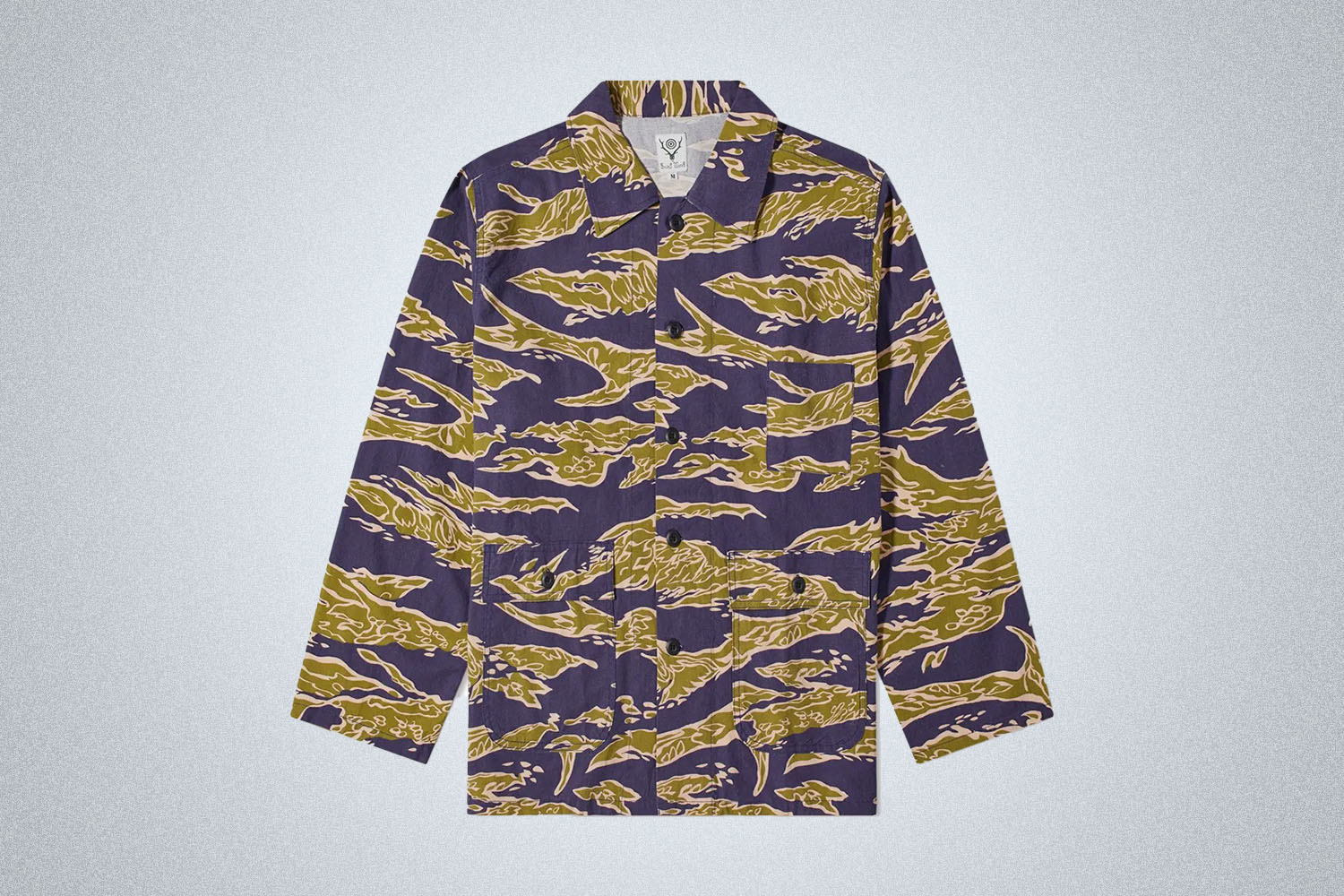 a camo overshirt from South2West8 on a grey background