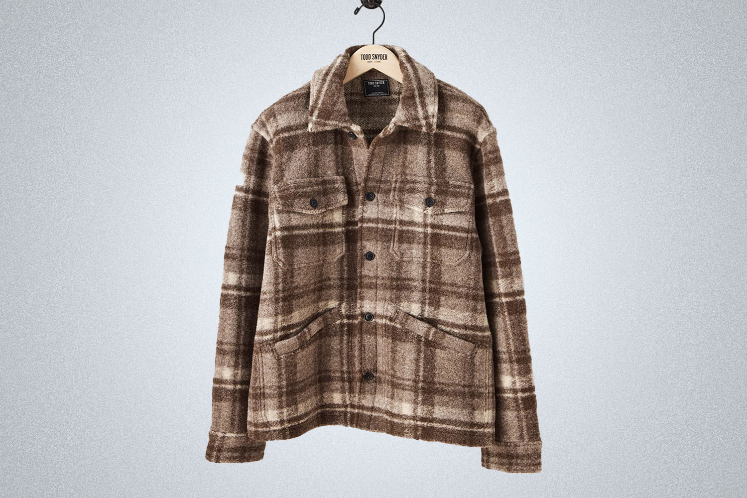 a brown wool checked overshirt from Todd Snyder on a grey background