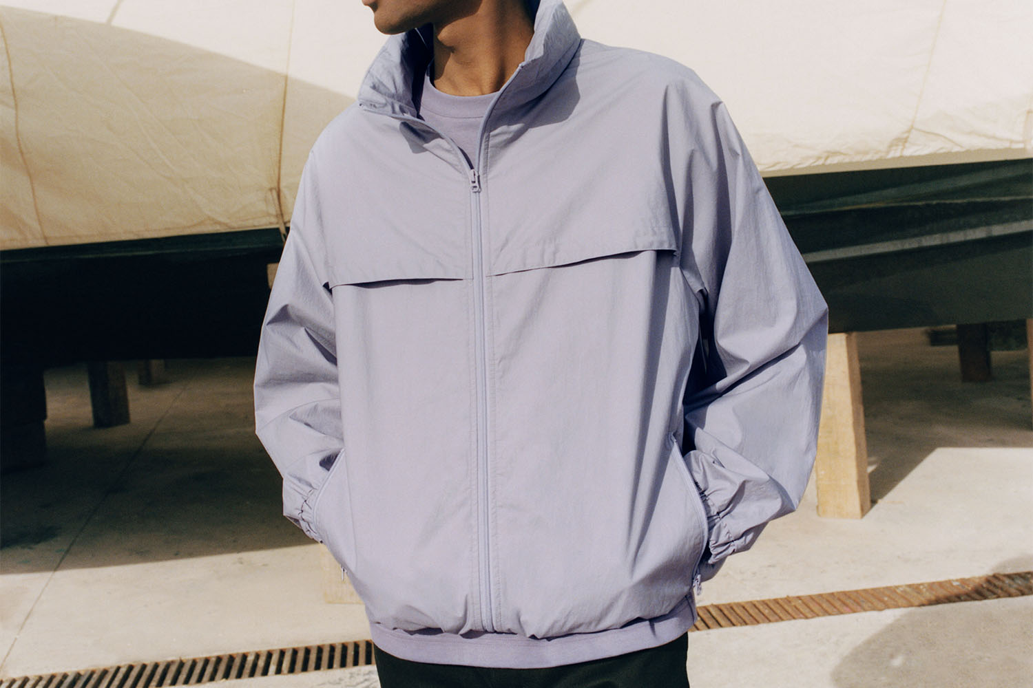 a taro-colored blouson with zip hood and buttons