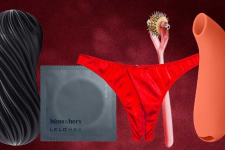 A black stroker, grey condom wrapper, red panty, pink pinwheel and orange suction vibrator,perfect Valentine's Day gifts, on a red background
