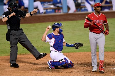 Justin Upton reacts to the strikeout call from umpire Chris Guccione
