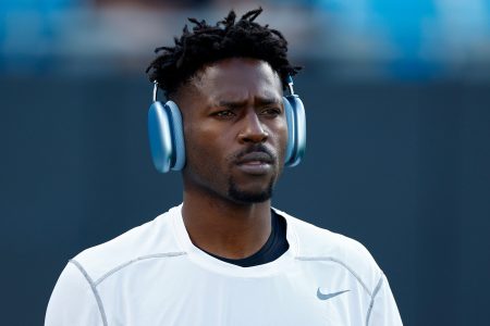 Antonio Brown warms up before the against the Carolina Panthers. Brown claims the Bucs offered him $200k in hush money to enter the "Crazy House" for mental health treatment