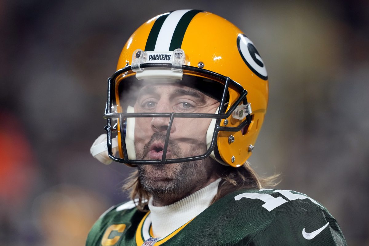 Aaron Rodgers of the Packers warms up before a game with the Vikings