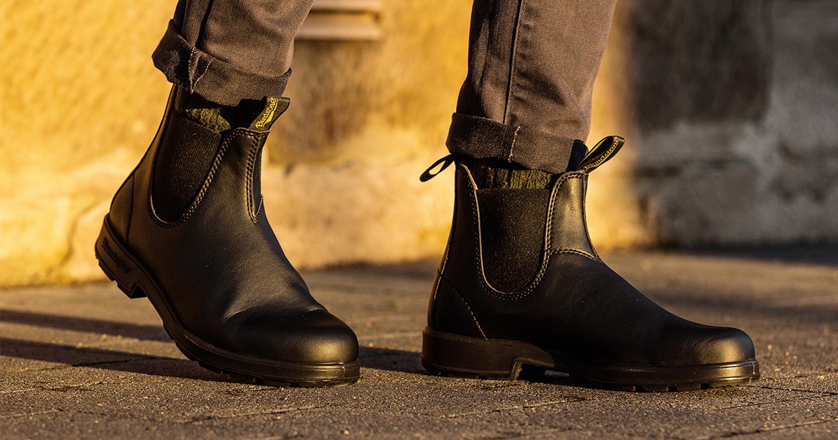 A man wearing Blundstone's #2115 Chelsea boots in black, the brand's first-ever vegan boots. We tested and reviewed them to see if they live up to the classic Blundstone #500.