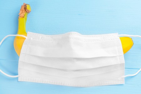 A surgical mask covers a banana