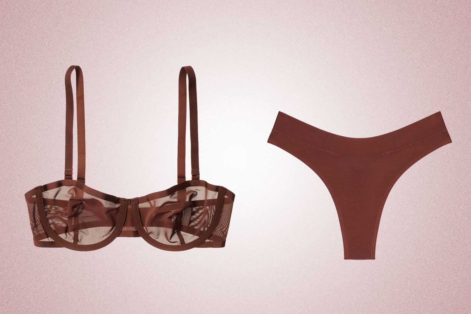 A brown mesh balconette style bra and brown thong, a perfect Valentine's Day gift, on a pink background. 