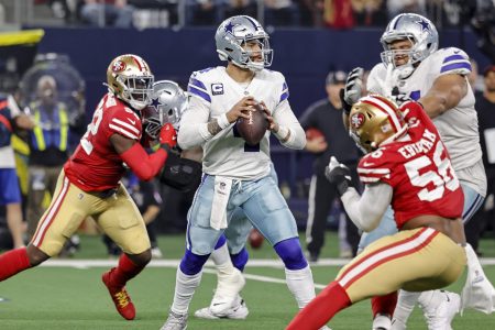 Cowboys quarterback Dak Prescott looks for an open receiver during the NFC Wild Card game with the San Francisco 49ers