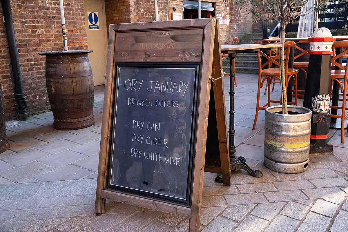 Amusing board outside The Banker pub makes reference to the modern construct that is 'Dry January' where upon people abstain from drinking alcohol for one month on 14th January 2022 in London, United Kingdom