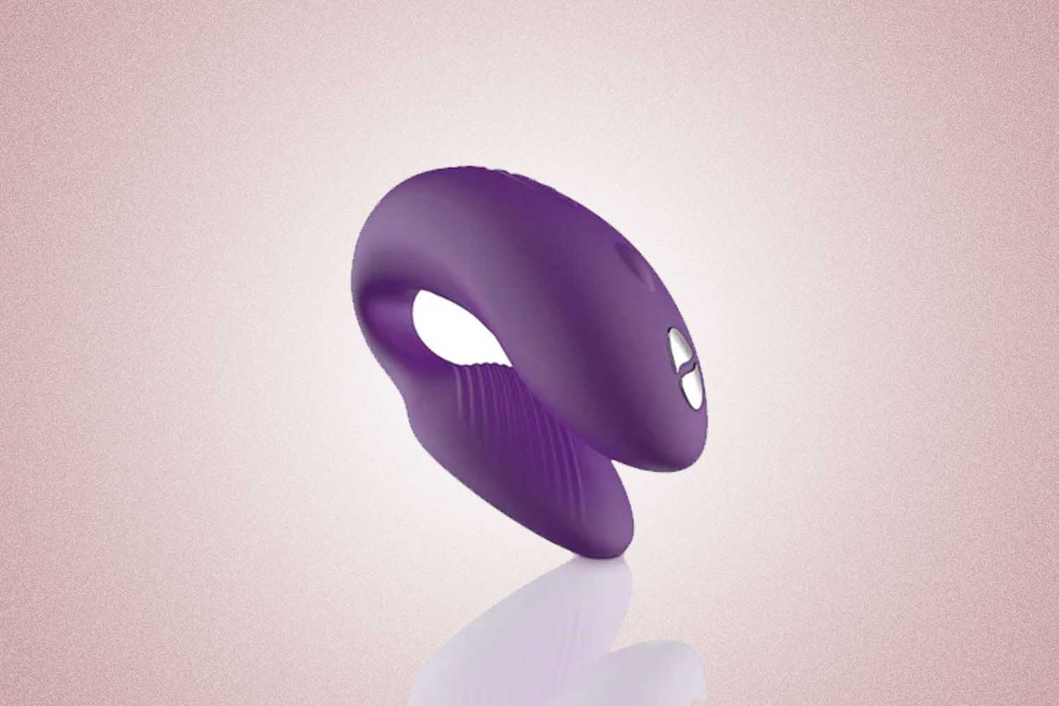 A purple couples vibrator from We-Vibe, a perfect Valentine's Day gift, on a pink background. 