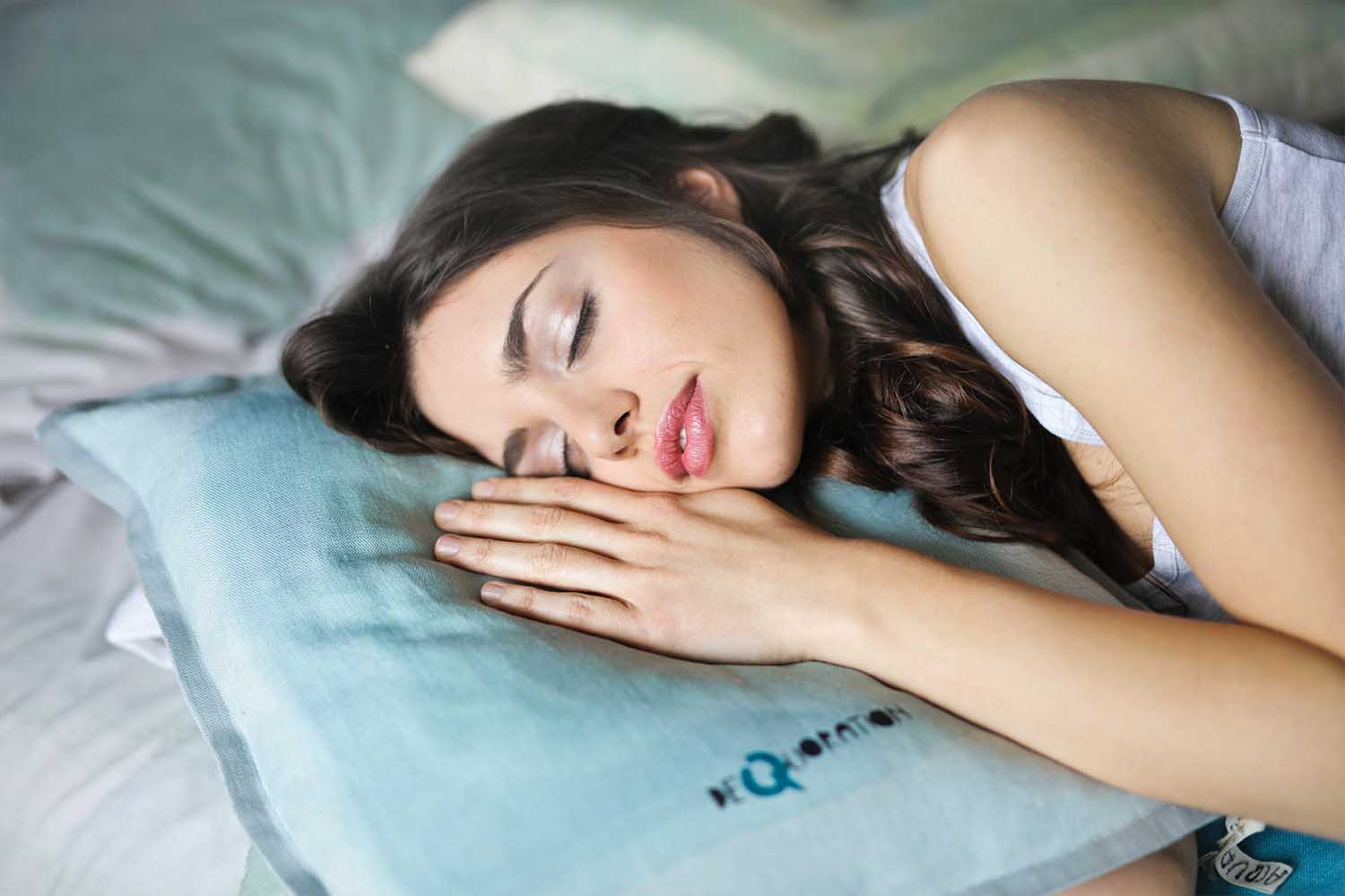 A woman napping on a pillow
