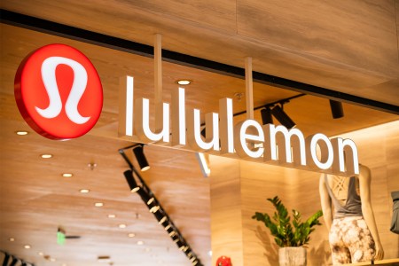 The Lululemon logo and name above a store in a shopping mall. The activewear brand was recently sued by Nike over Mirror, a connected fitness company it acquired in 2020.