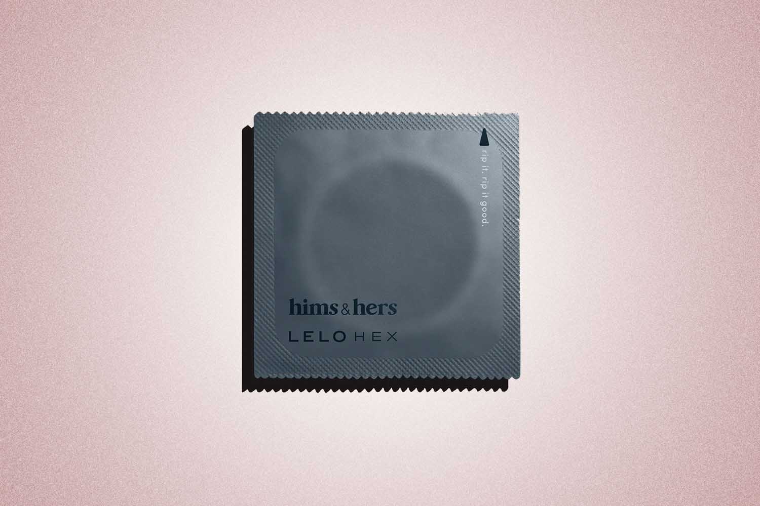 A grey condom wrapper from Hims, a perfect Valentine's Day gift, on a pink background. 