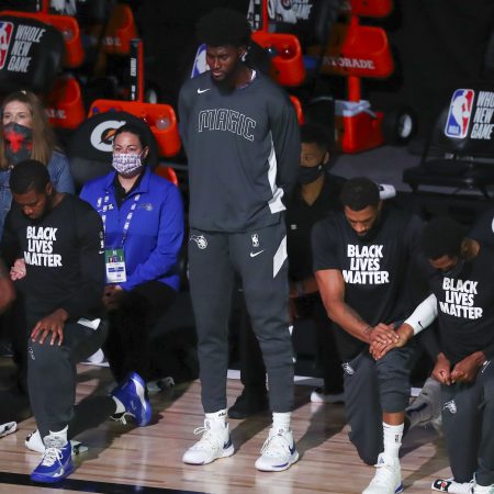 Jonathan Isaac stands during the national anthem before an NBA game. Isaac is releasing a new book through Ben Shapiro's publishing house.