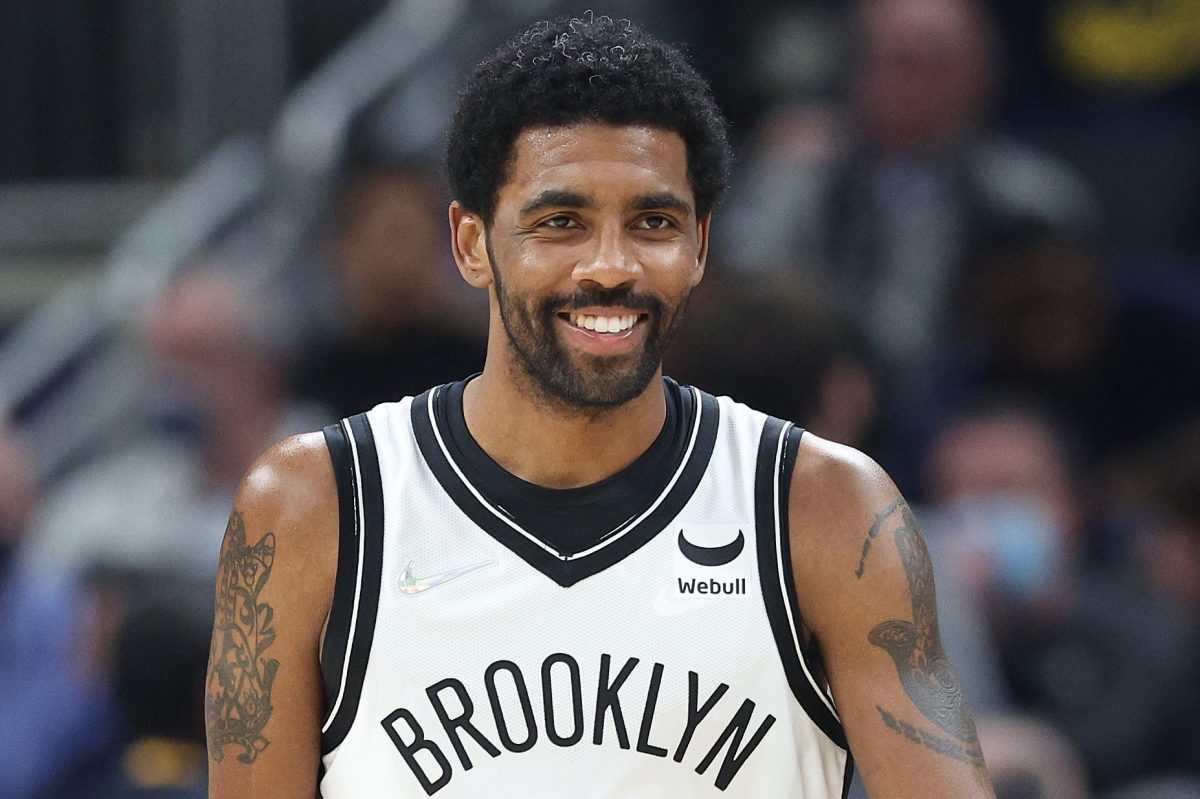 Kyrie Irving dribbles the ball during a 2022 game against the Pacers. The unvaccinated NBA star could technically play in Brooklyn if the Nets pay a fine.