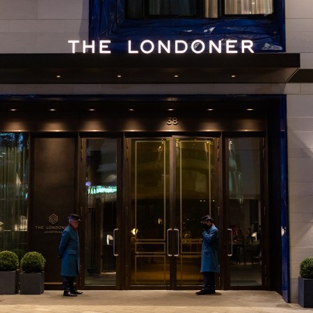 Two "quintessentially British" doormen stand guard at the Londoner Hotel