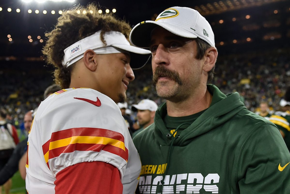 Aaron Rodgers of the Packers shakes hands with Patrick Mahomes of the Chiefs. In a poll of the most popular NFL players before the playoffs in 2022, Mahomes beats Rodgers by a considerable margin.