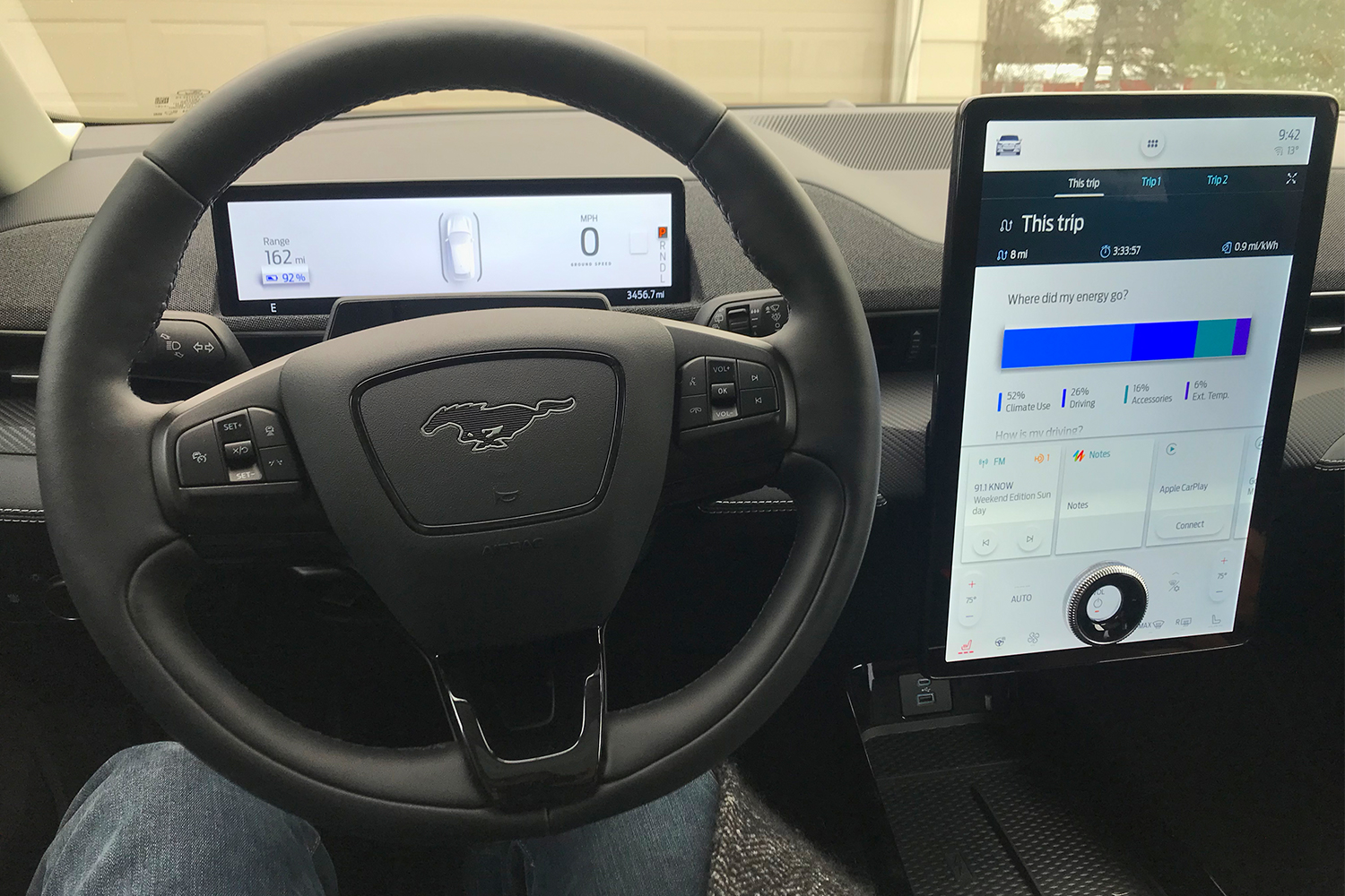 The dashboard of the 2021 Ford Mustang Mach-E electric crossover SUV, including the heated steering wheel and giant touchscreen