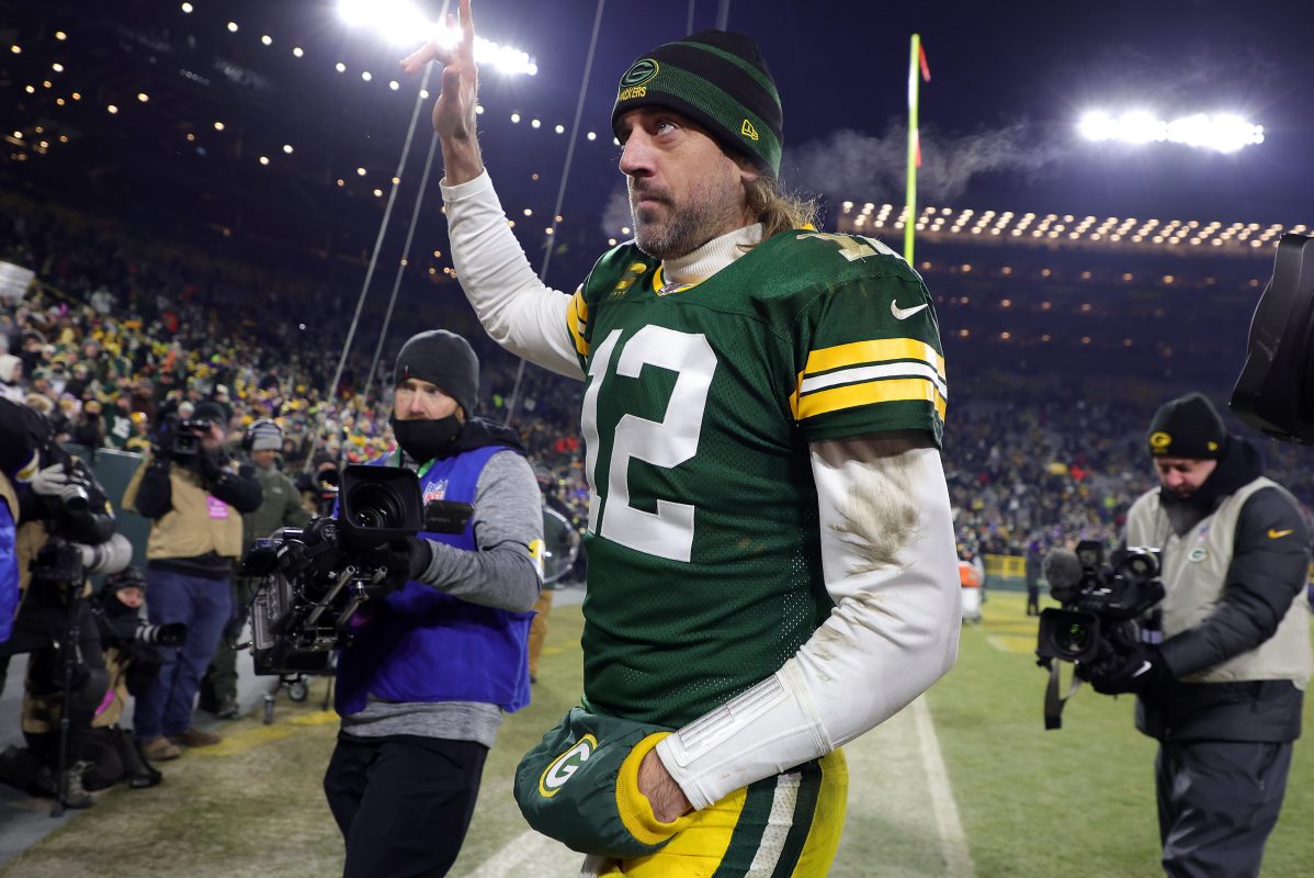 Aaron Rodgers walks off the field after the Packers defeat the Vikings 37-10. One voter will not be giving Rodgers an MVP vote, calling him a "jerk."