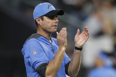 Coach Brandon Staley of the LA Chargers looks on before coaching against the Raiders at Allegiant Stadium in January 2022