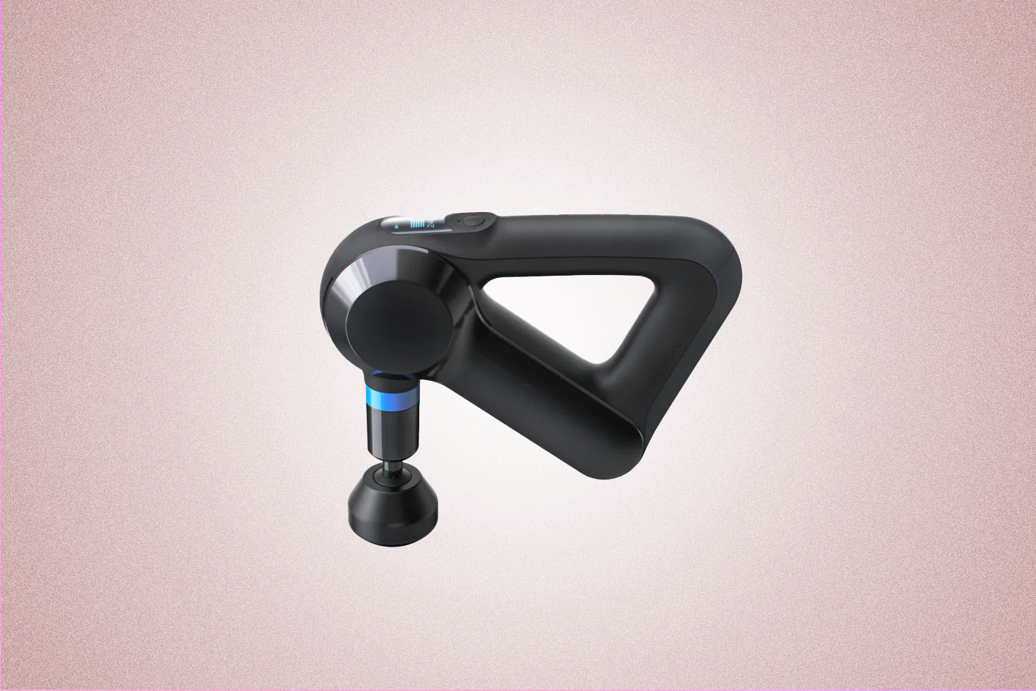 A black massage gun from Theragun, a perfect Valentine’s Day gift for 2022, on a pink background.