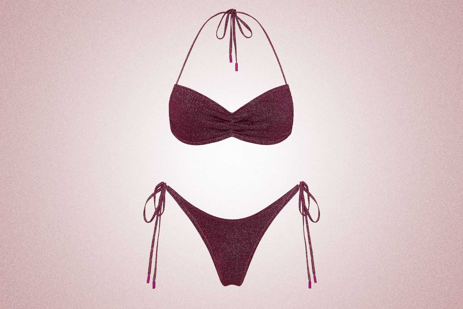 A sparkly purple bikini from Triangl, a perfect Valentine’s Day gift for 2022, on a pink background.