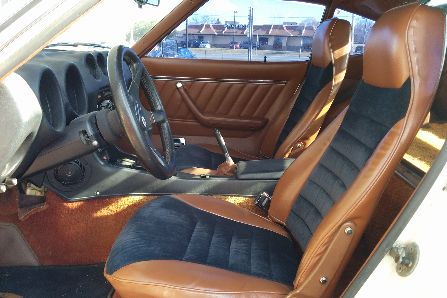 The black and tan interior of a 1978 Datsun 280Z sports car. Here's what it's like to own one.