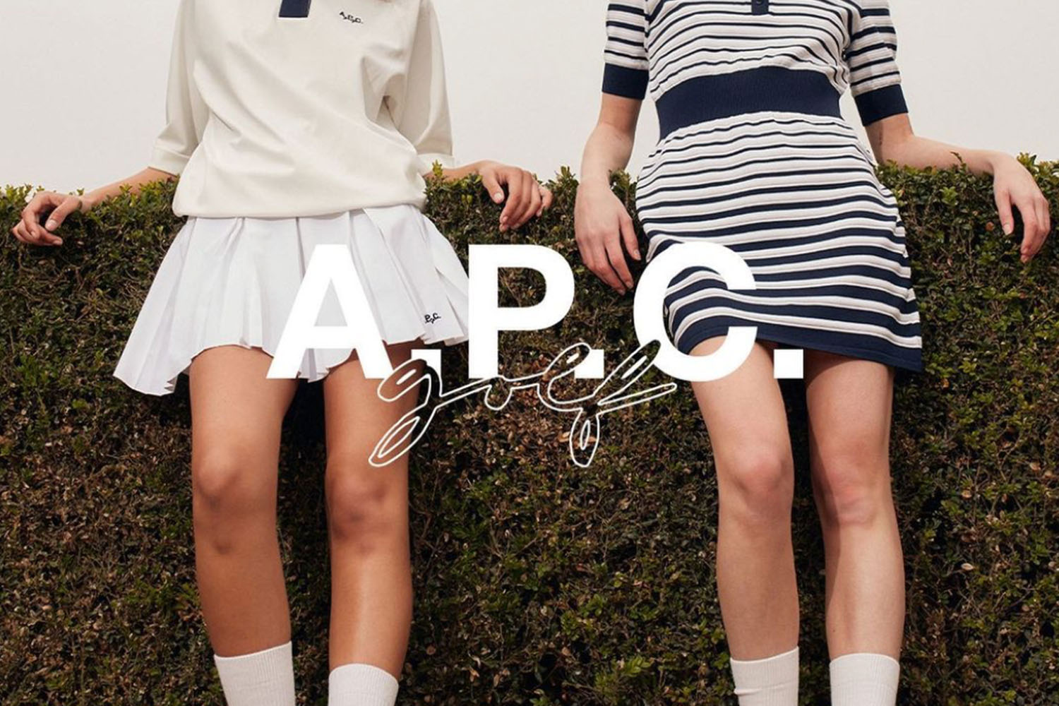 two girls in tennis girl with the APC golf logo