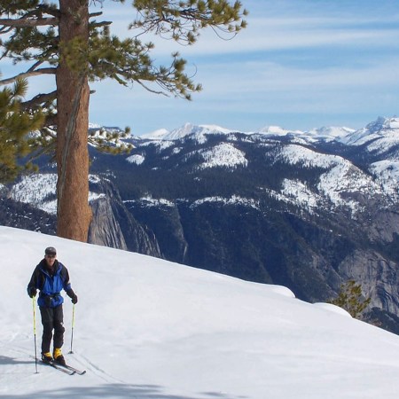 A photo of a skier and mountains cape