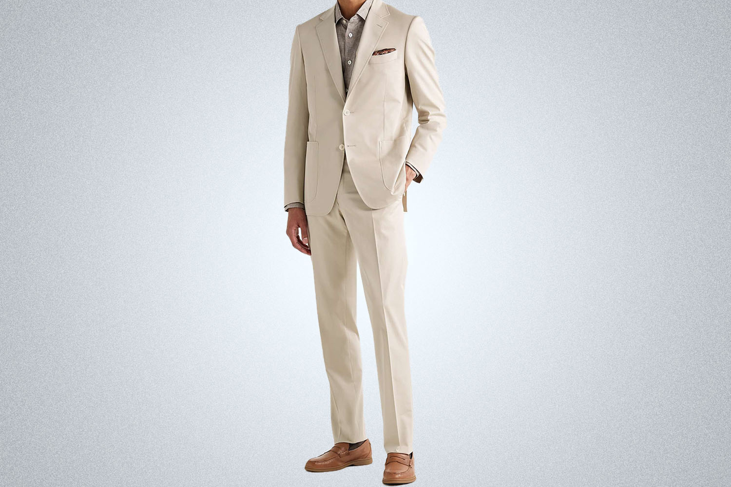 a cream colored suit on a model