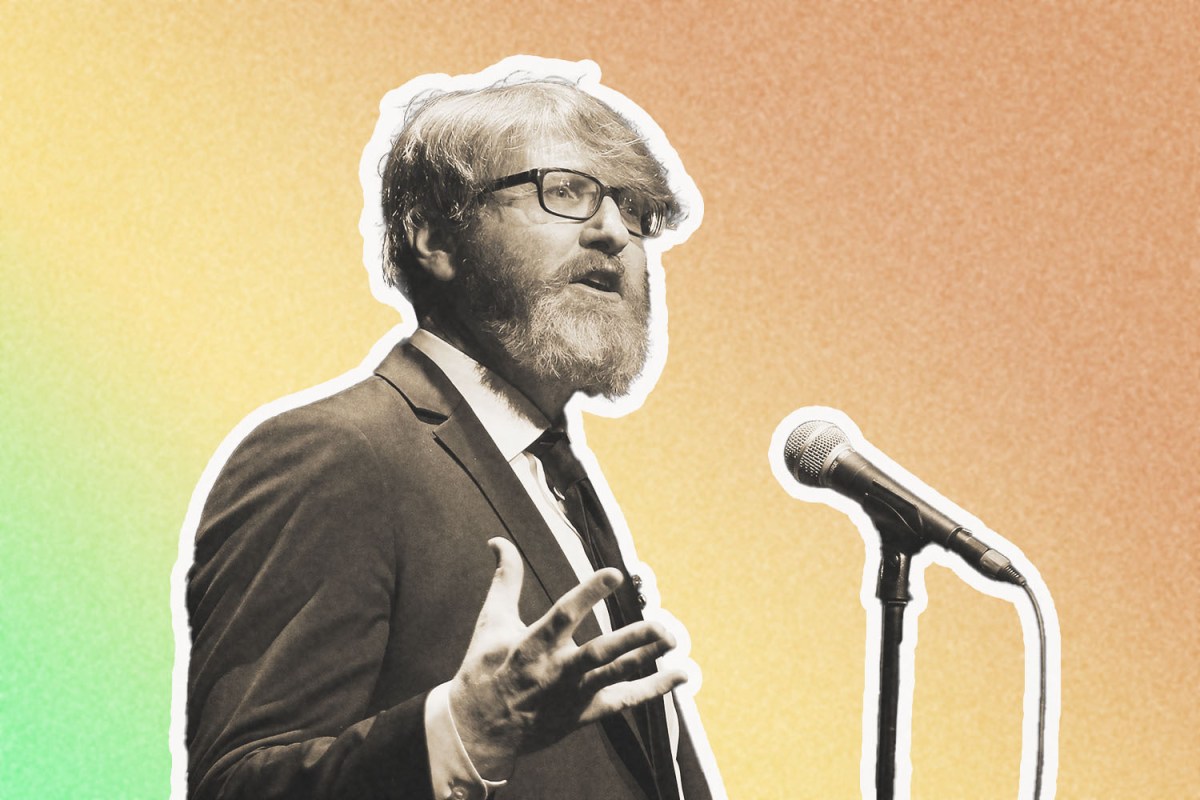 Chuck Klosterman speaks into a microphone