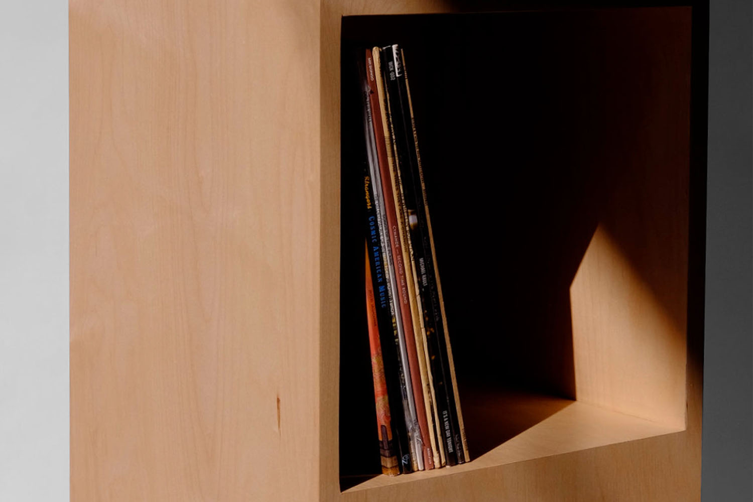 a wooden record shelf