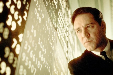Man looks pensively at wall of data.