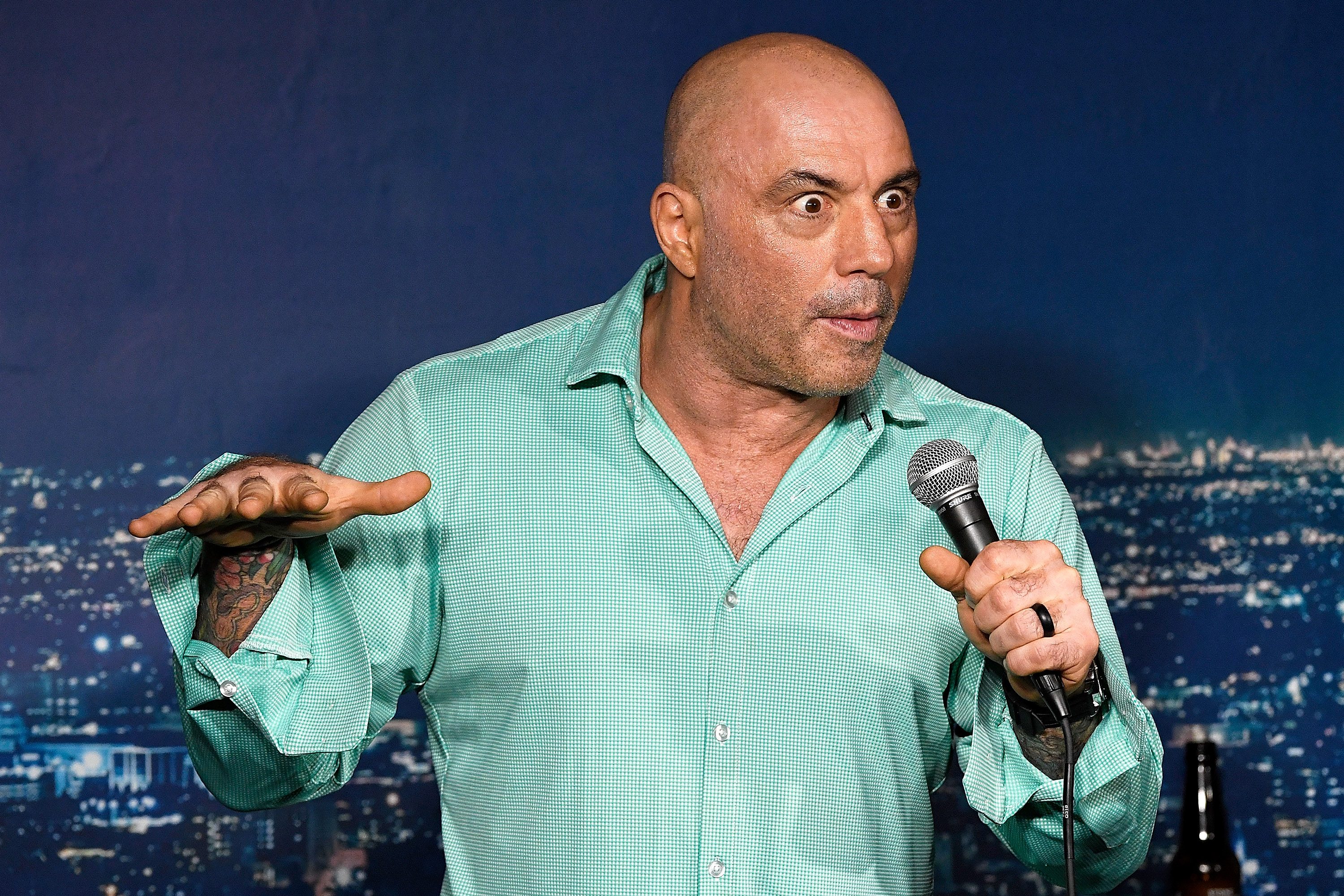 Joe Rogan performs during his appearance at The Ice House Comedy Club on March 15, 2019 in Pasadena, California. After Neil Young and Joni Mitchell left Spotify over Rogan's podcast, other artists are leaving too, some for different reasons.