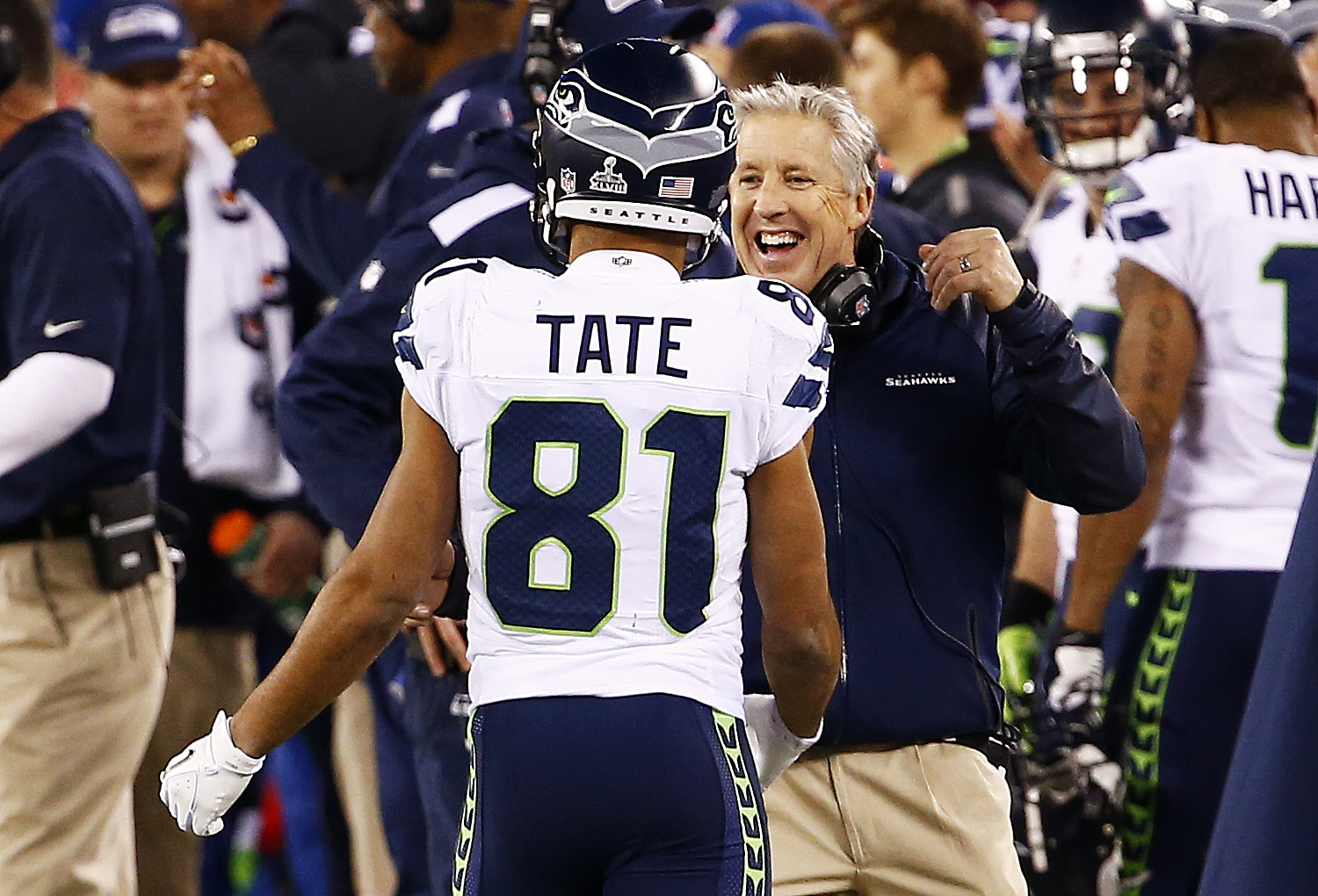 Pete Carroll celebrates with wide receiver Golden Tate after Super Bowl XLVIII at MetLife Stadium on February 2, 2014 in East Rutherford, New Jersey
