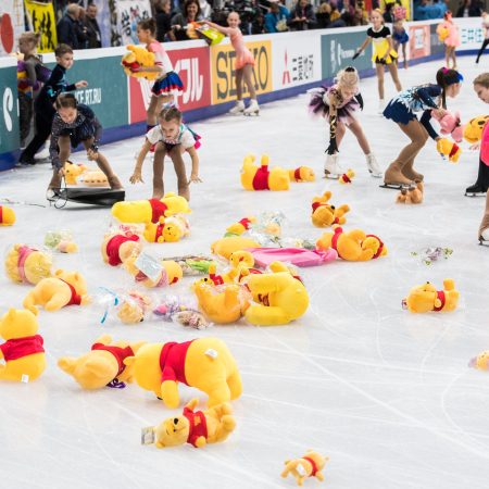 Children collect stuffed toy bears from the ice after Japan's Yuzuru Hanyu performed his routine in the men's short program at the Rostelecom Cup 2017 ISU Grand Prix.