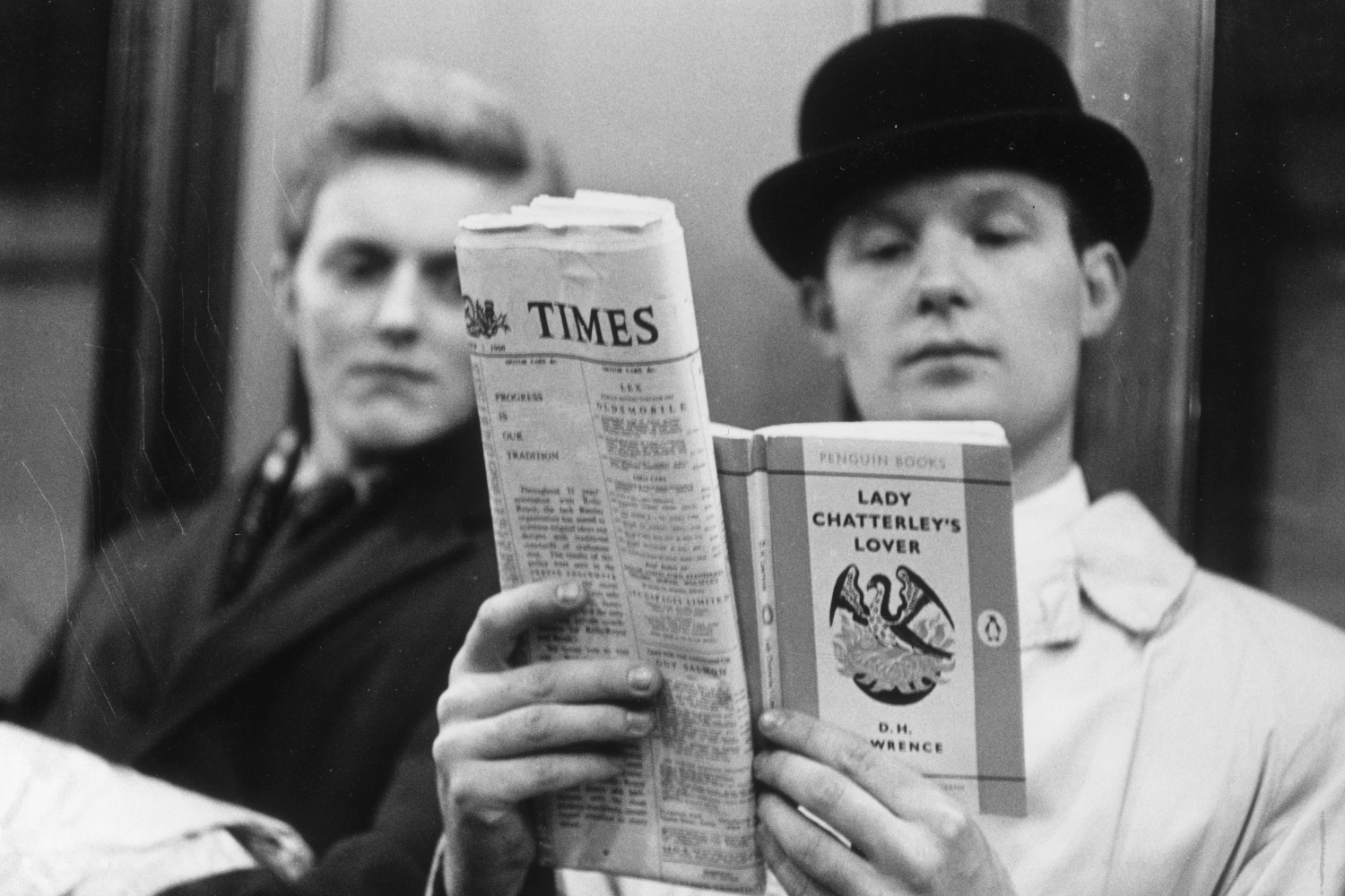Fox photographer George Freston poses as a passenger on the London Underground, reading D H Lawrence's 'Lady Chatterley's Lover' on the day the book went on general sale, after a jury in the Old Bailey found that the book was not an obscene publication.