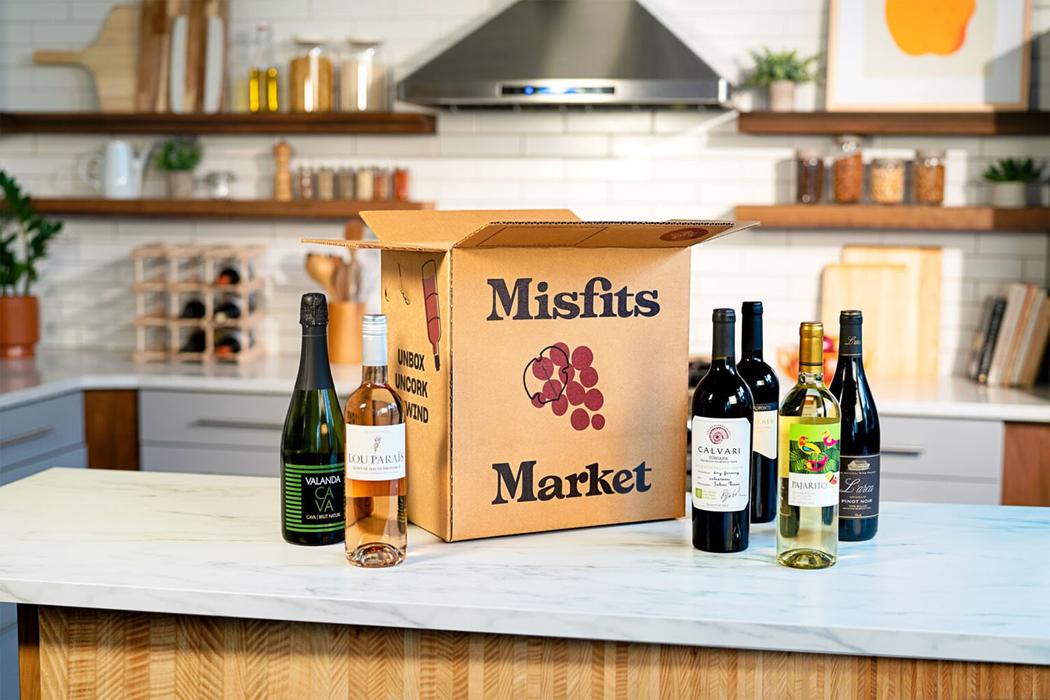 a box and wine on a kitchen table