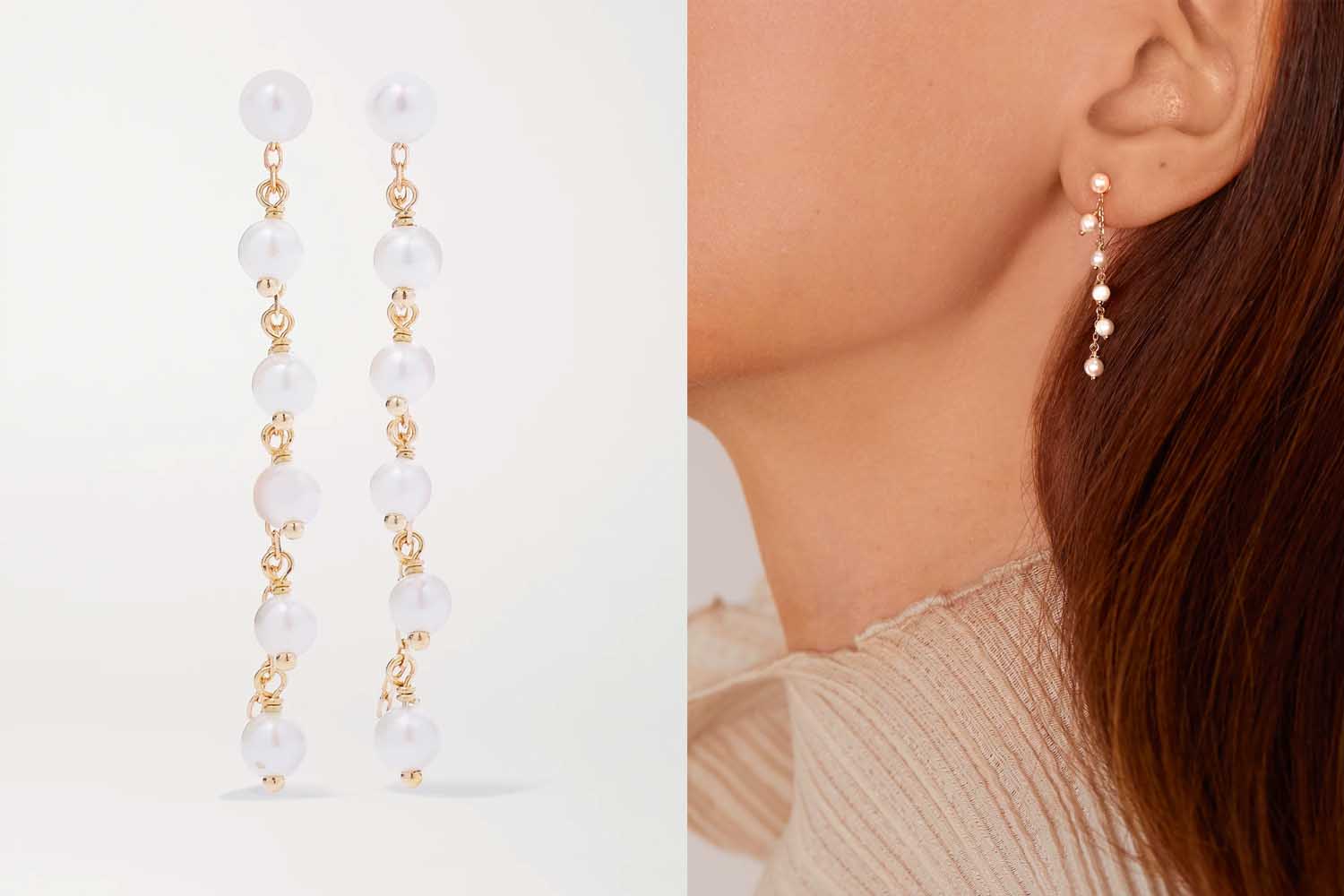 A pair of earrings strung with gold chain links and pearls, a perfect valentine's day gift, on a pink background. 