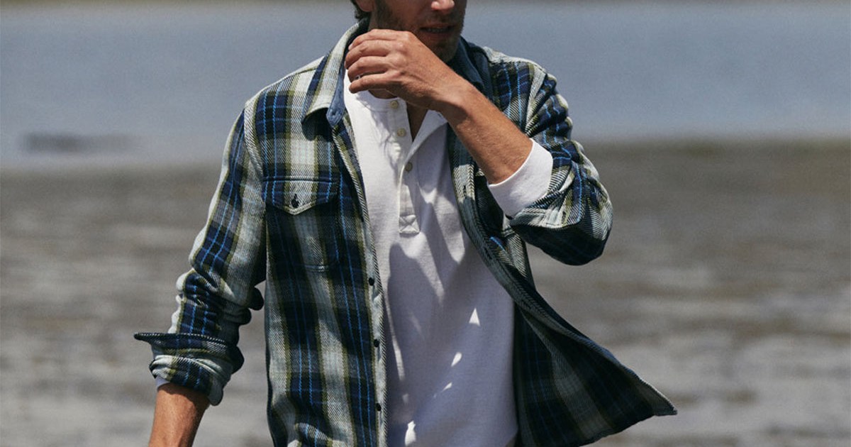 a model walking in an Outerknown blanket shirt