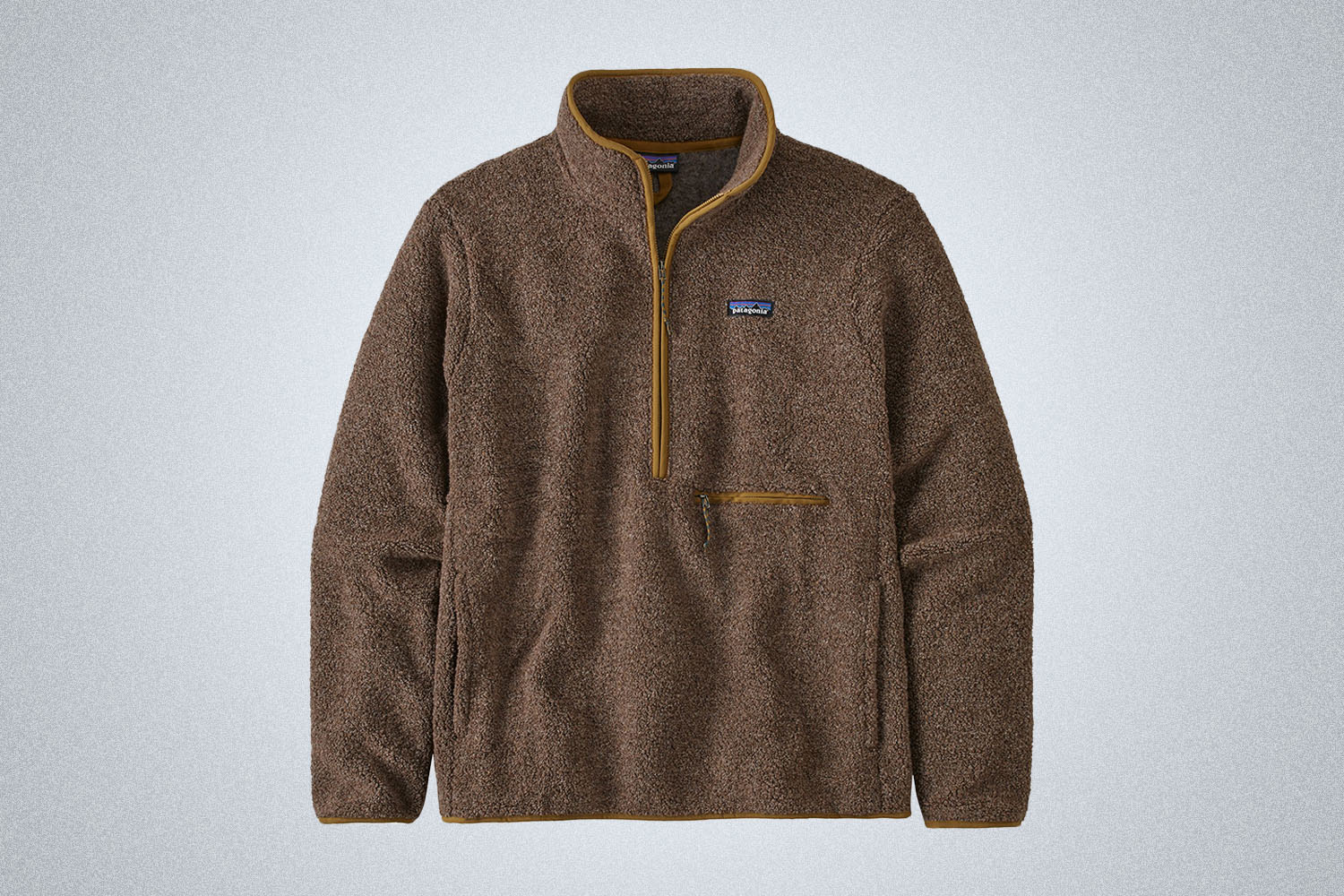 a brown fleece on a grey background