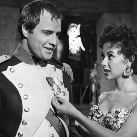 Marlon Brando and Rita Moreno visit on the set of the film 'Desiree', 1954. The couple dated for years; the actress recently claimed Brando "was a bad guy when it came to women."