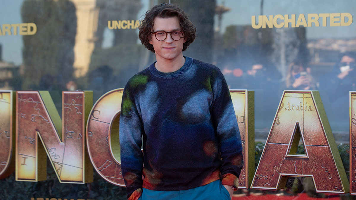Tom Holland in a Paul Smith jumper and pants on the red carpet in Barcelona
