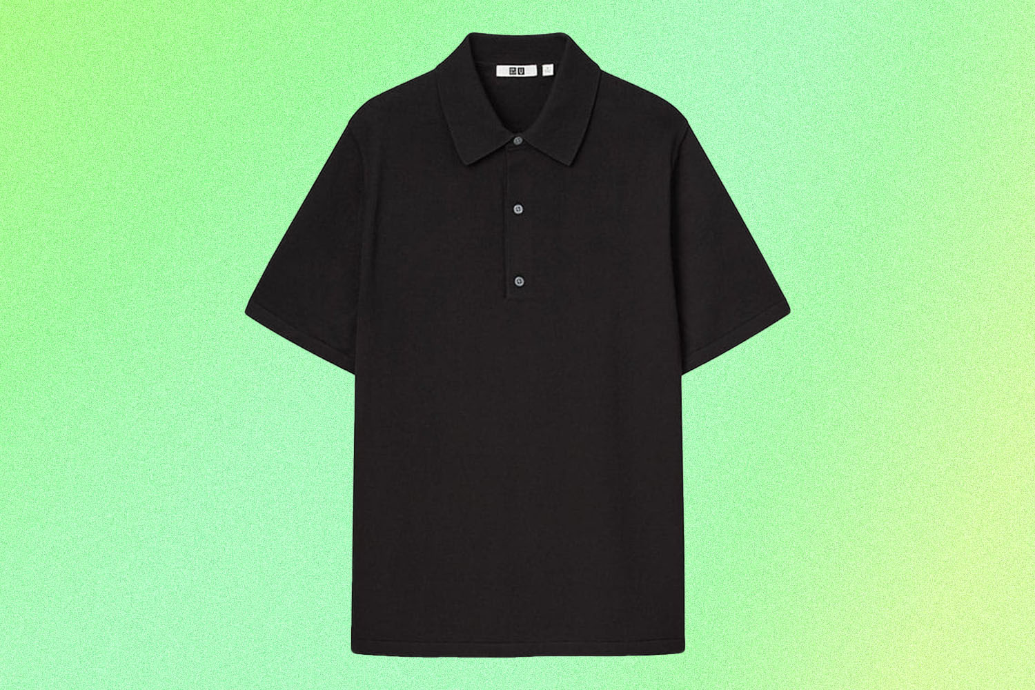 a black knit polo on a green background