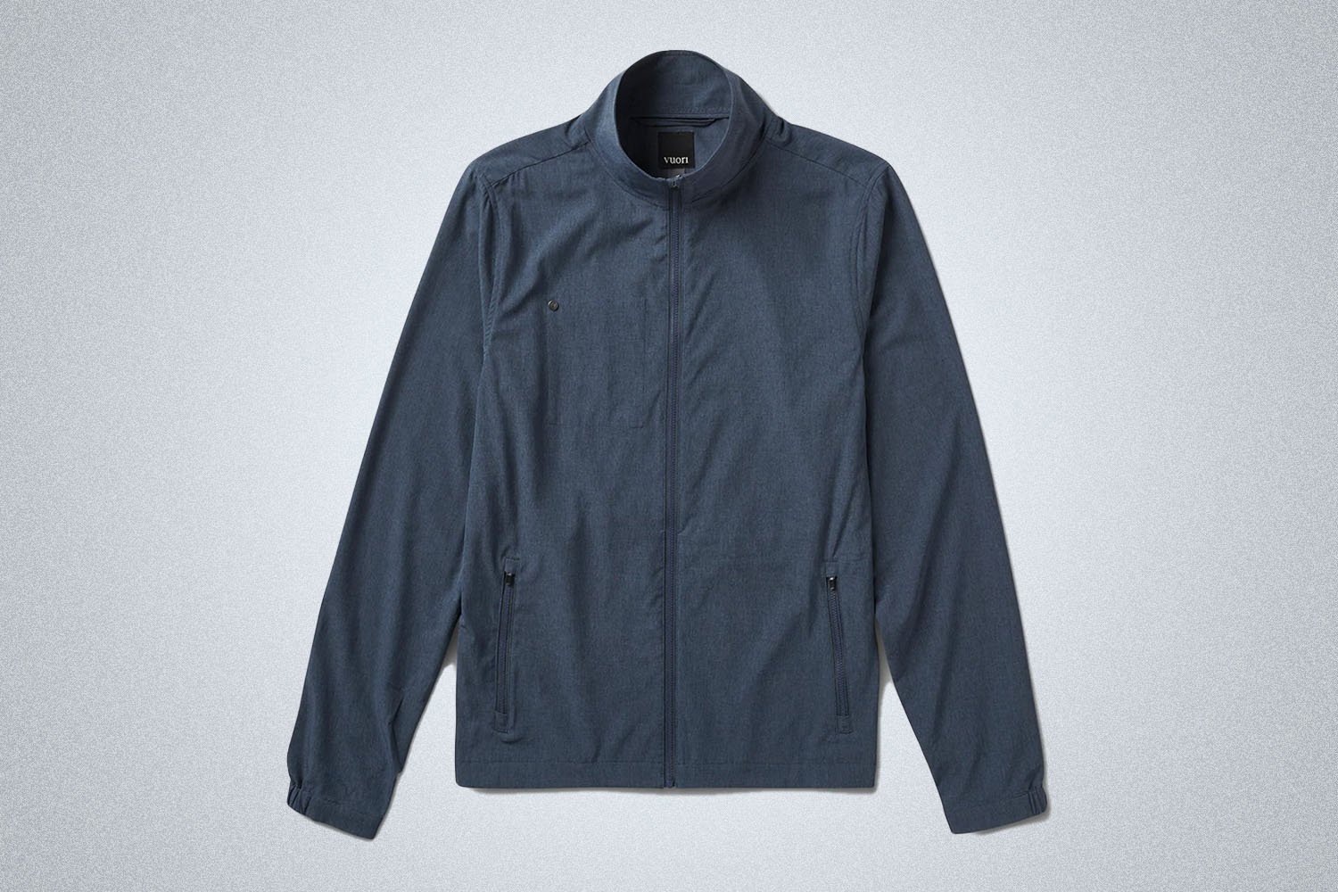 a blue linen track jacket on a grey background