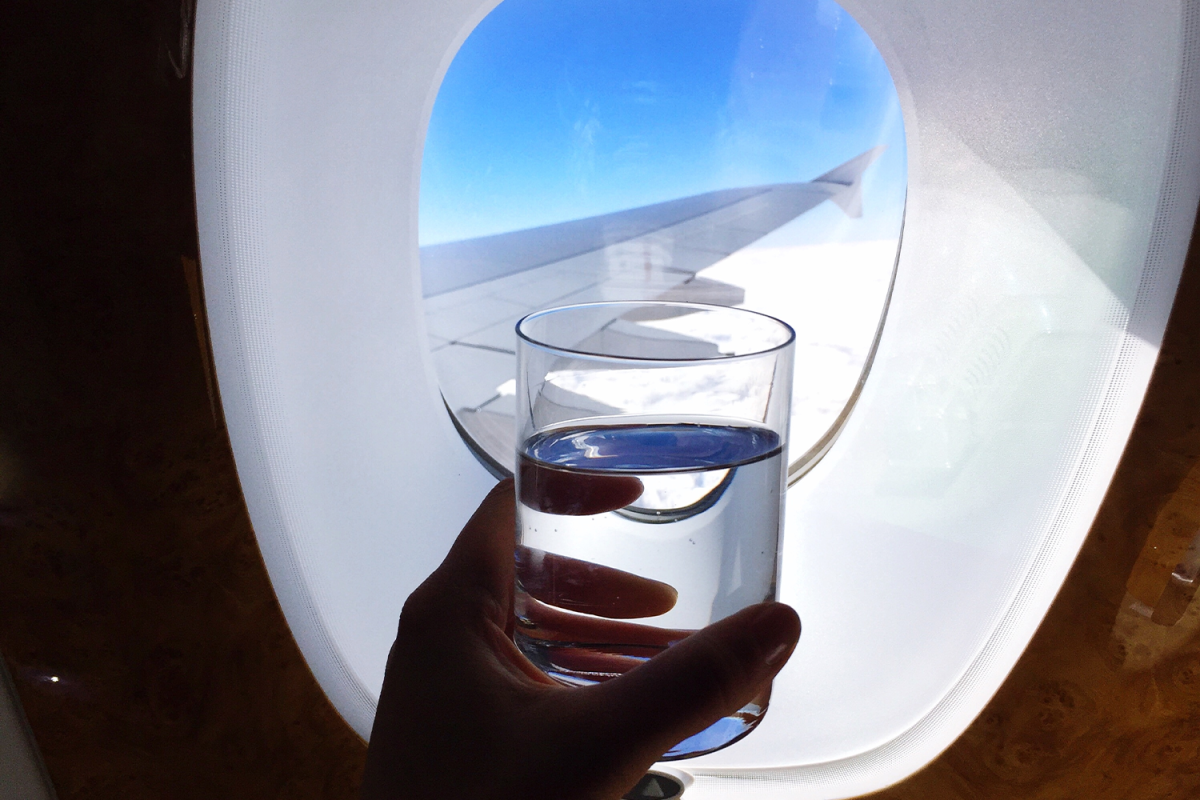 Here's Why You Should Never to Drink Water Inflight InsideHook