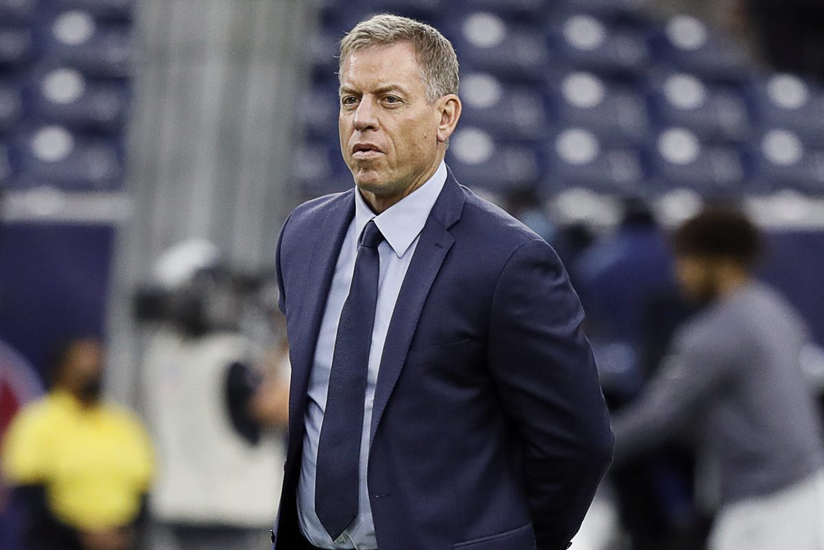 Troy Aikman watches warmups prior to a game between the Carolina Panthers and the Houston Texans. According to the New York Post, Aikman will be leaving Fox to broadcast Monday Night Football at ESPN.