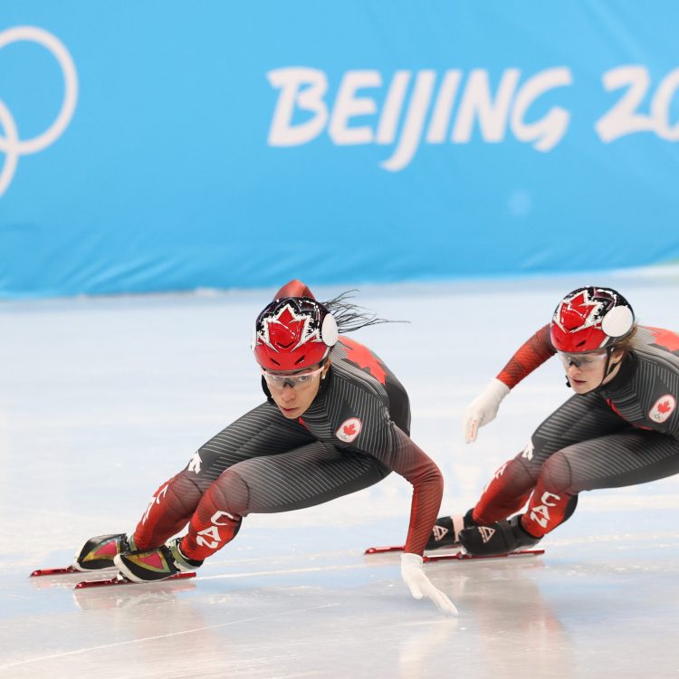 Alyson Charles and Kim Boutin of Team Canada at speed-skating practice for the 2022 Beijing Winter Olympics. These Games are projected to cost 10 times what China projected, according to Insider.
