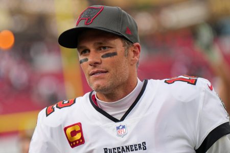 Tom Brady looks on during a game with the Philadelphia Eagles. In a new episode of the "Let's Go!" podcast, Brady hinted that he could return to play in the NFL.